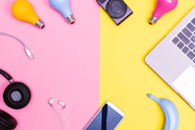 High angle view of objects on colored background