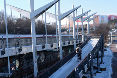 Rear view of man riding bicycle on ramp