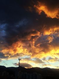 Scenic view of silhouette mountain against sky during sunset