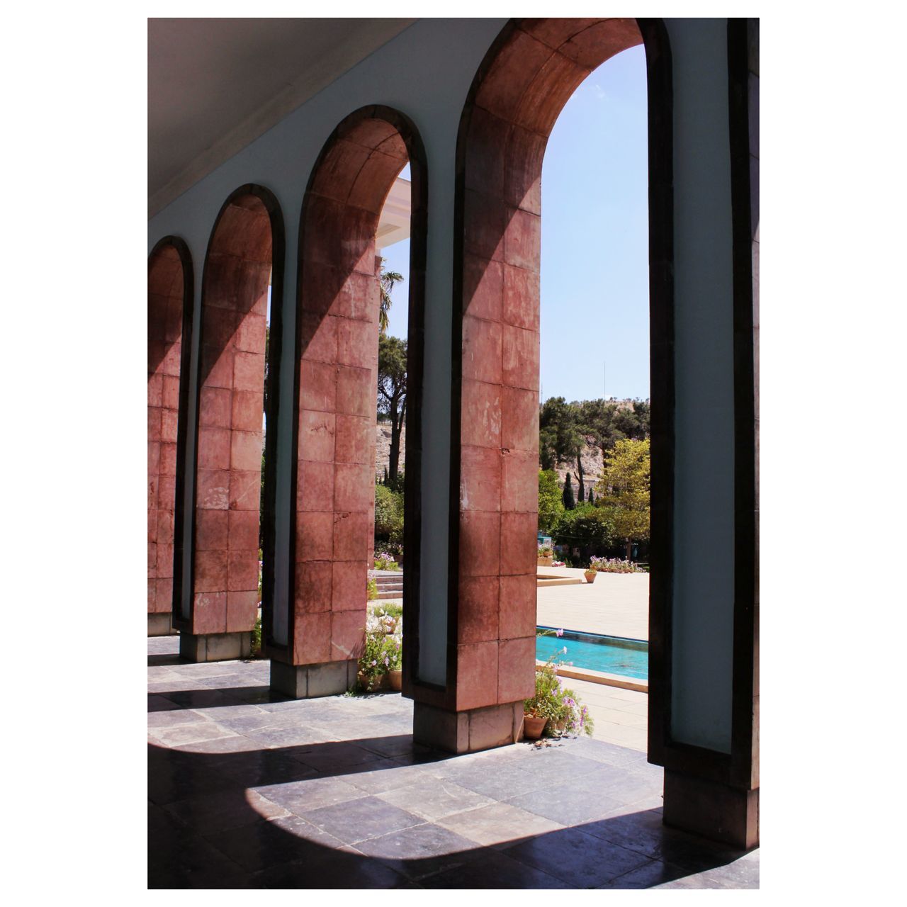 arch, architecture, built structure, nature, no people, day, architectural column, sunlight, travel destinations, building exterior, transfer print, outdoors, sky, history, building, entrance, plant, the past, clear sky, window, travel