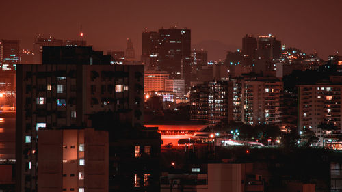 Illuminated buildings in city at night