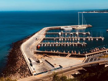 High angle view of road by sea against sky