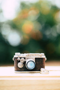 Close-up of camera on table