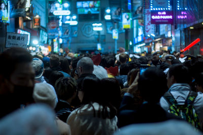 Crowd in city at night