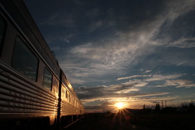 Train against sky at sunset