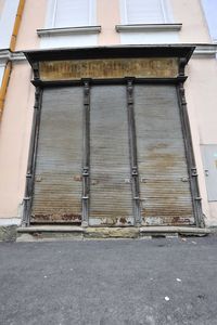 Low angle view of closed window of old building