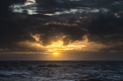 Scenic view of dramatic sky over sea