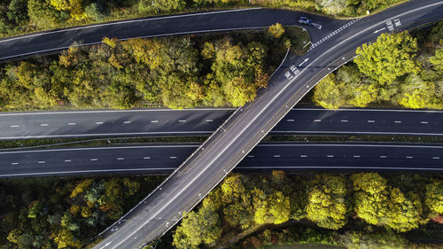 High angle view of bridge over road in forest