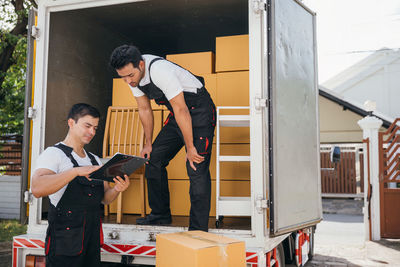 Side view of young man working in office