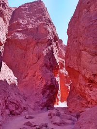Low angle view of rock formations against sky