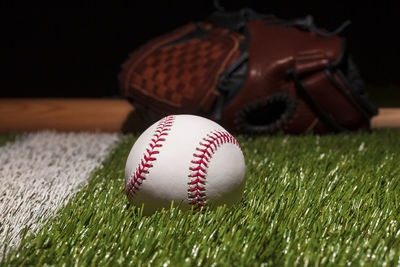 Close-up of baseball on grass