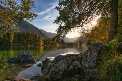 Scenic view of lake and mountains against sky