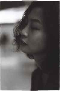 Close-up of young woman with eyes closed