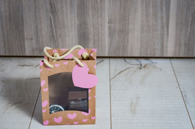 Close-up of pink heart shape on table