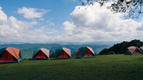 Tent on field against sky