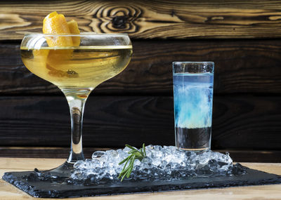 Close-up of cocktails on slate at restaurant