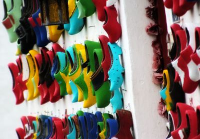 Full frame shot of multi colored clogs hanging at market stall