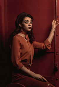 Portrait of a young woman sitting outdoors