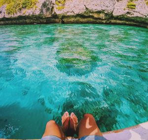 Low section of woman in swimming pool