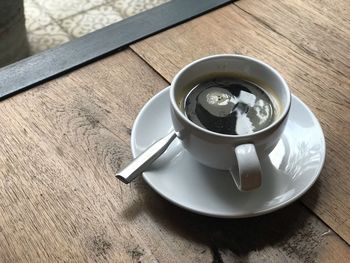 High angle view of coffee cup on table