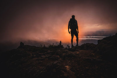 Silhouette of hiker at sunset in the clouds, appalachian trail, maine