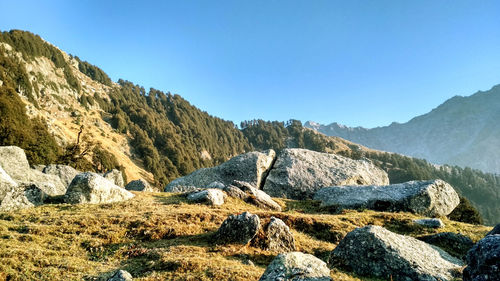 Scenic view of mountains against clear blue sky