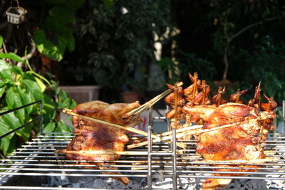 Close-up of meat on barbecue grill