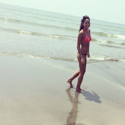 High angle view of woman standing on beach