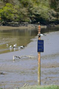 Information sign against river