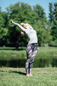 Side view of man standing on field