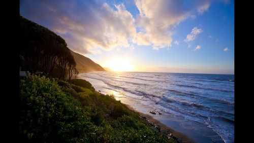 Scenic view of sea at sunset