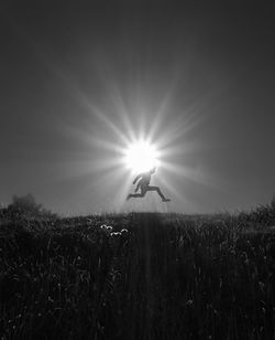 Man on field against sky