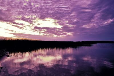 Scenic view of lake at sunset