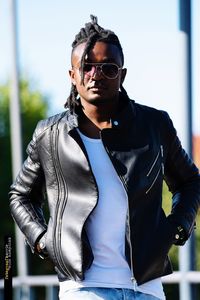 Portrait of young man wearing sunglasses standing outdoors