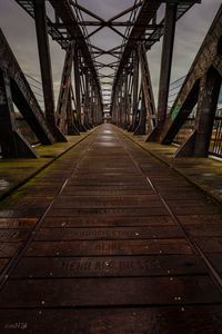 Low angle view of railway bridge against sky