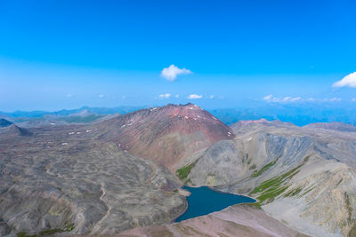 View of volcanic landscape against blue sky