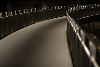 Park path at night. the light of the fanars on the embankment bridge. path in the dark. 