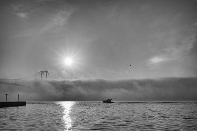 Scenic view of sea against sky and fog