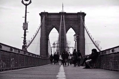 Tourists on bridge in city