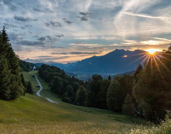 Scenic view of landscape against sky during sunset