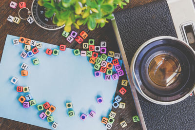 High angle view of multi colored leters on table