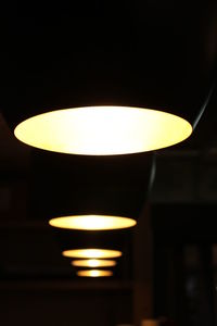 Low angle view of lit lamp