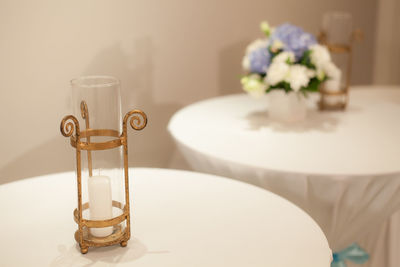 Close-up of candle on table at home