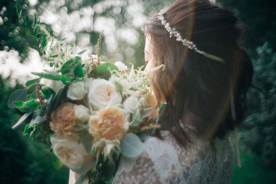 Close-up of bride with bouquet