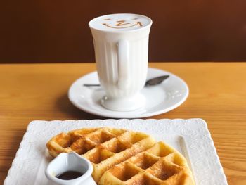 Close-up of coffee served on table