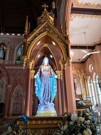 Statue in temple outside building