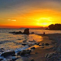 Scenic view of sea at sunset