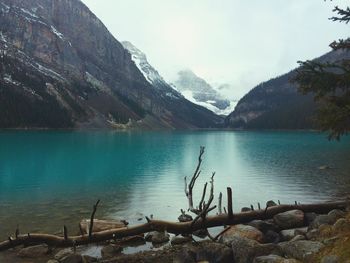 Scenic view of lake and mountains against sky