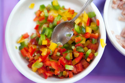 High angle view of chopped vegetables in bowl on table