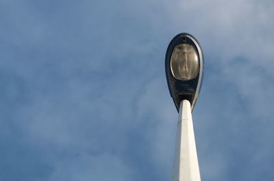 Low angle view of street light against sky